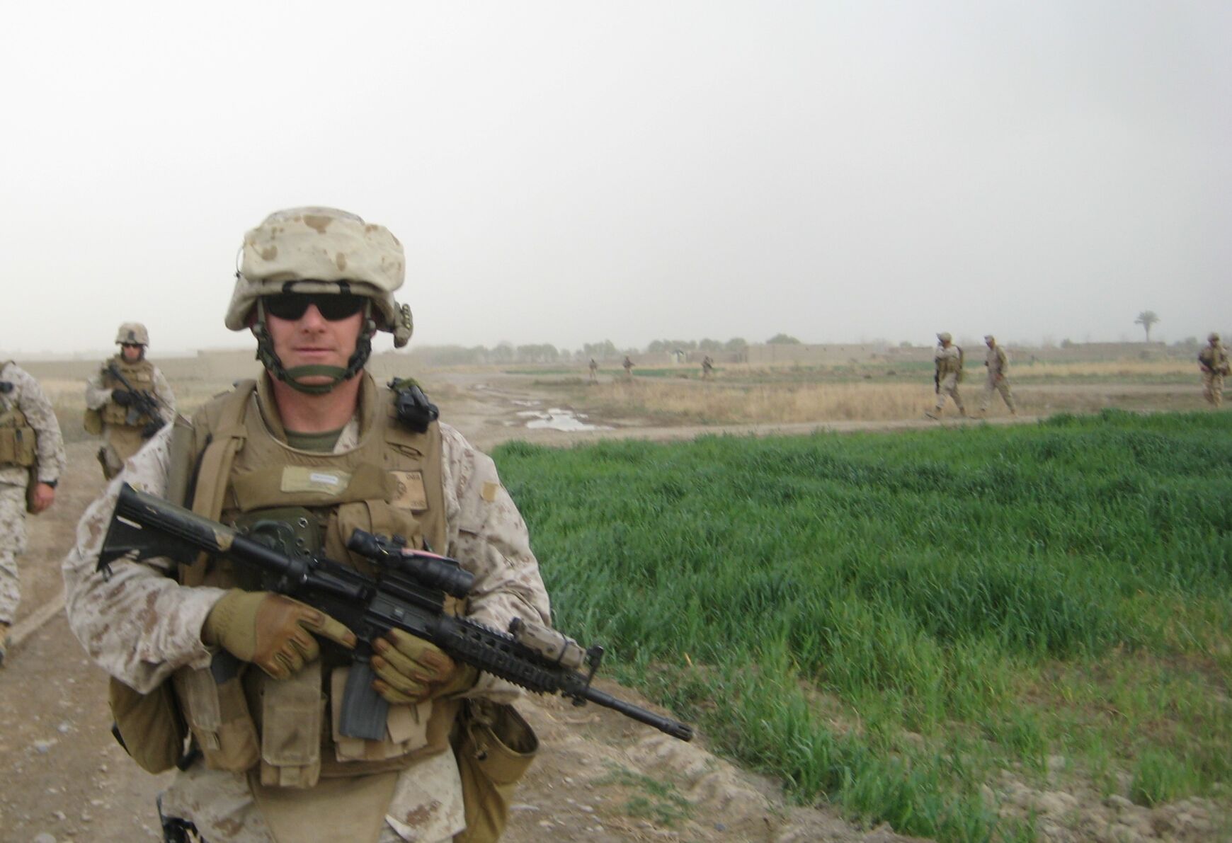 Steve Schultze in uniform holding a gun